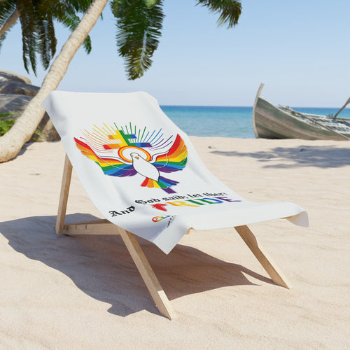 And God Said; Let There Be Pride™ premium beach towel featuring rainbow faith typography celebrating LGBTQ+ identity and spiritual affirmation by The Pride & Purpose Collection™
Beach chair with a towel featuring a logo and text on a sandy beach with palm trees and ocean in the background.